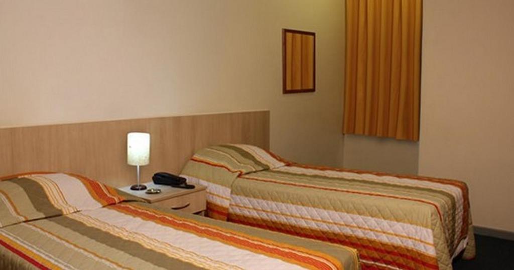 Euro Hotel Куритиба Стая снимка